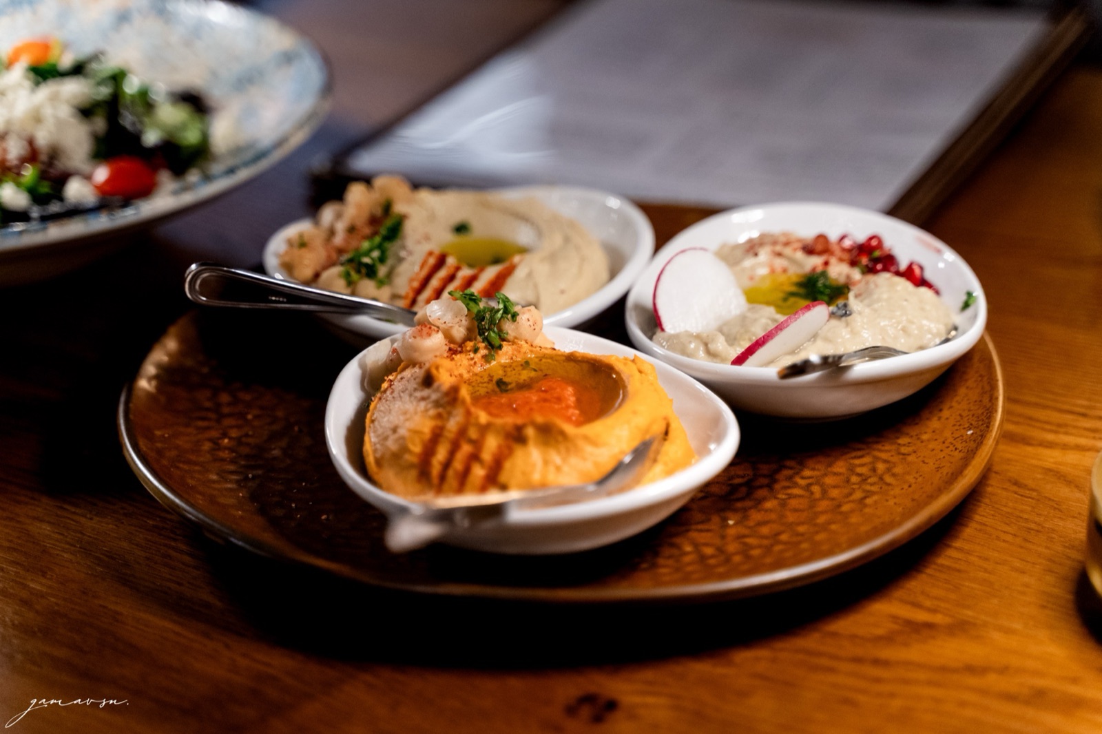 Hummus trio with greek salad and toasted pita