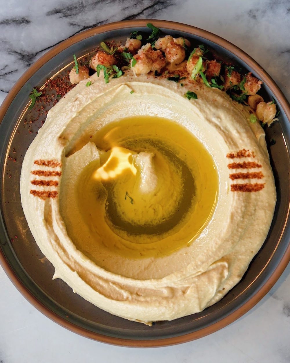 Mezzé #1 hummus topped with olive oil and paprika